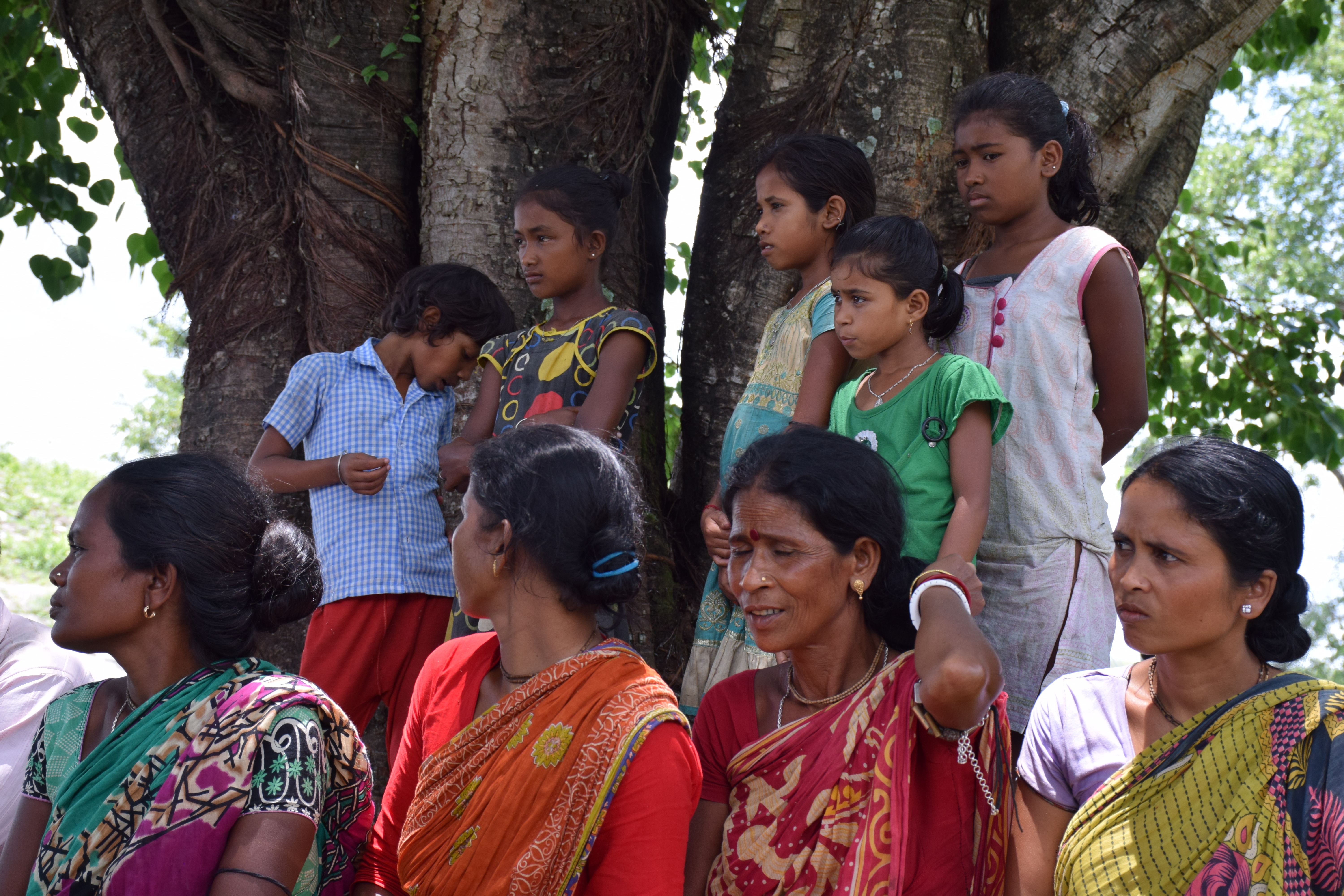 Samir Mehta/International Rivers Women and girls listen in Gazadoba Village No. 12 during a cross-border exchange.